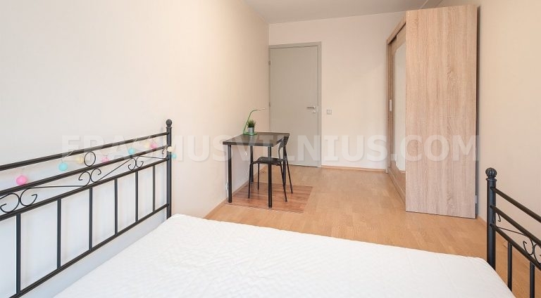 Second bedroom (16 m²) with natural light and king size bed in Flat 2, Vilnius