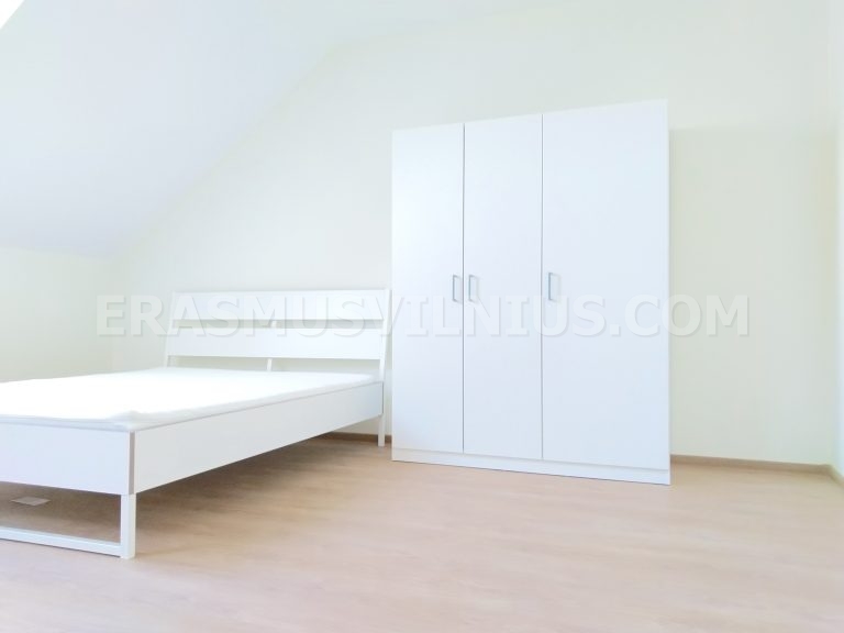 Freshly renovated bedroom with new flooring and paint