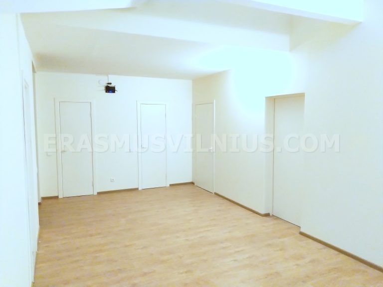 Flat interior at sunset showing spacious hallway and rooms