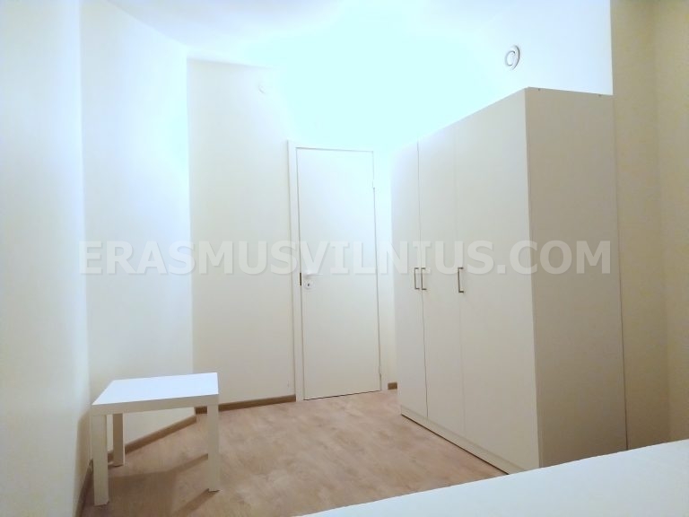 Fully equipped kitchen with oven, cooktop and fridge at sunset