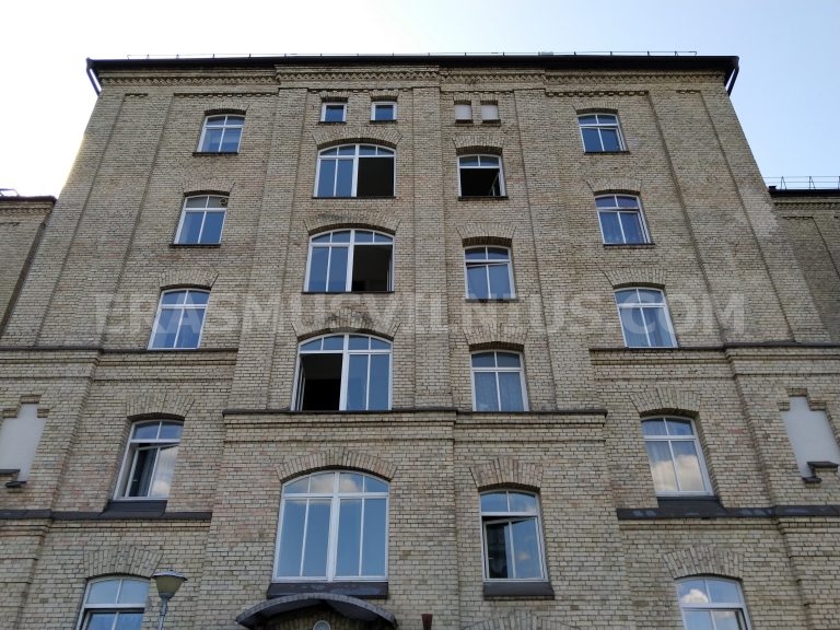 Summer view from bedroom window — Vilnius old town rooftops