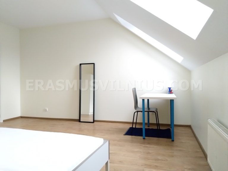 Clean bathroom with tiled walls and shower in Flat 4