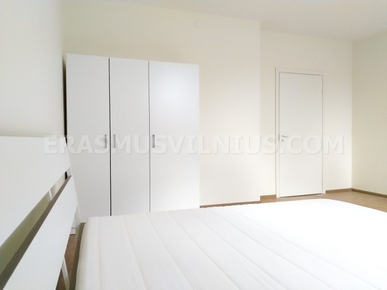 Full bathroom view with shower, toilet and sink in Vilnius flat